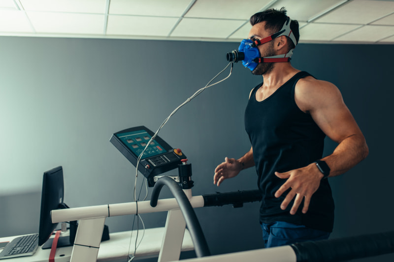 Man running on treadmill taking lung capacity test