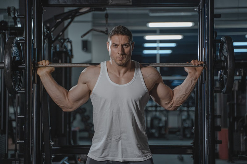 Man Using Power Rack