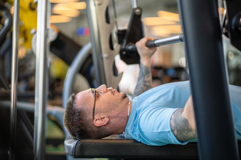 Tired Man Lifting Weights