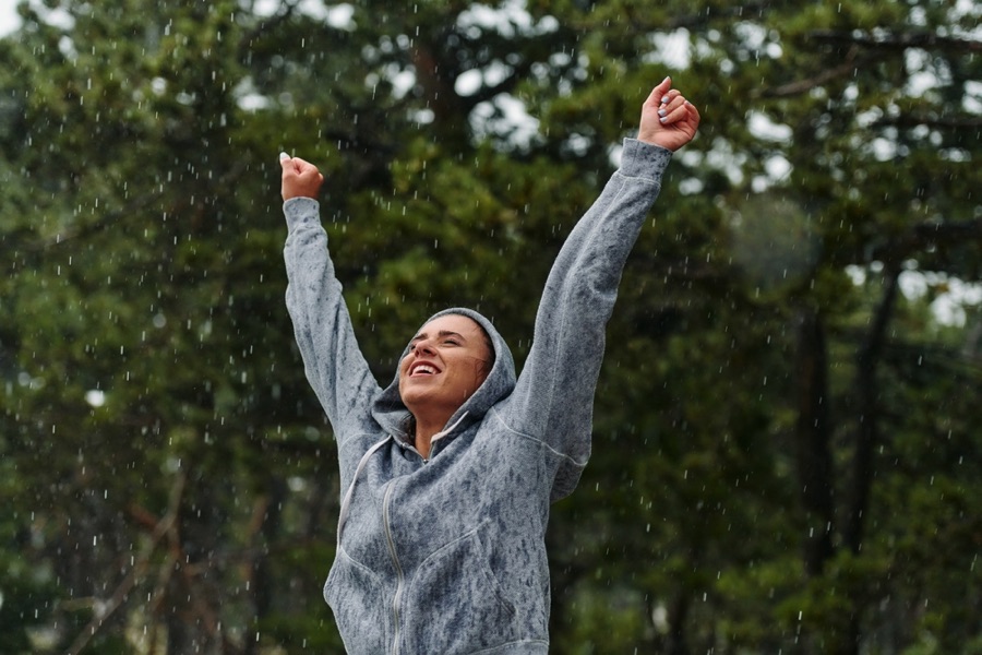 Woman running in the rain