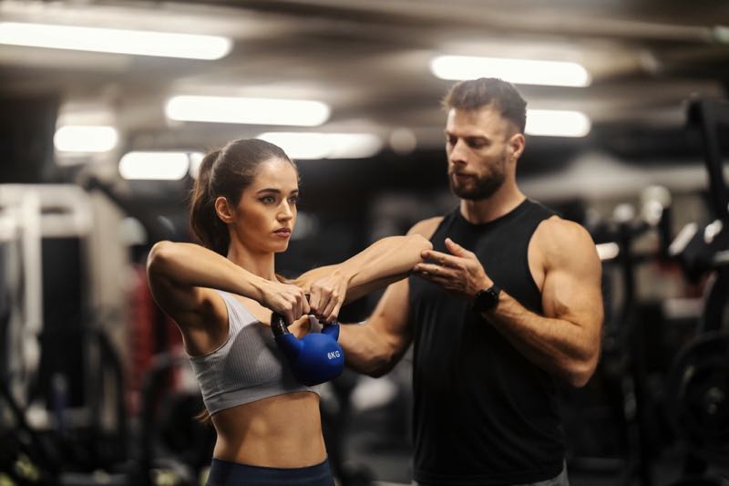 Personal trainer with client