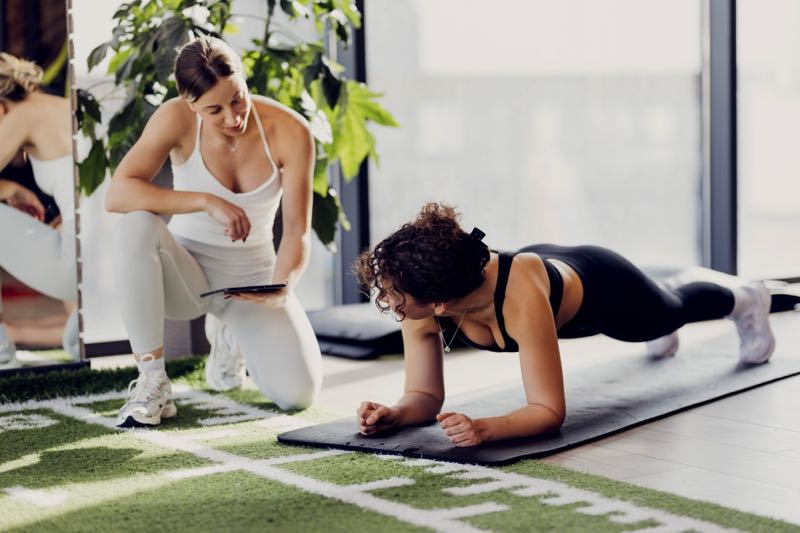 Personal trainer with woman